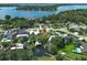 Aerial view of a charming neighborhood featuring a waterfront home and a private boat dock at 2417 Bayfront Pkwy, Orlando, FL 32806