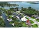Aerial shot of a home in a neighborhood with waterfront property and beautiful greenery at 2417 Bayfront Pkwy, Orlando, FL 32806
