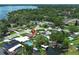 Overhead view of a cozy home, surrounded by lush greenery, a private pool, and boat dock at 2417 Bayfront Pkwy, Orlando, FL 32806