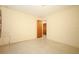 Empty bedroom featuring neutral walls, terrazzo flooring, and standard closet at 2417 Bayfront Pkwy, Orlando, FL 32806
