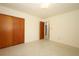 Spacious bedroom with closet and an open doorway, ready for your personal touch at 2417 Bayfront Pkwy, Orlando, FL 32806