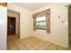 Bright dining area showcasing tile floors and natural light streaming in from a window at 2417 Bayfront Pkwy, Orlando, FL 32806