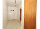 Bright entryway with a front door featuring glass panes and a light fixture, leading into the home at 2417 Bayfront Pkwy, Orlando, FL 32806
