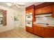 Classic kitchen featuring wood cabinetry and double ovens at 2417 Bayfront Pkwy, Orlando, FL 32806
