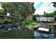 Scenic waterfront view showcasing a private boat dock and serene backyard at 2417 Bayfront Pkwy, Orlando, FL 32806