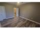 Comfortable bedroom with wood-look flooring, offering a tranquil retreat with ample natural light at 2558 Robert Trent Jones Dr # 1435, Orlando, FL 32835