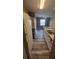The kitchen has white cabinets and wood floors at 2558 Robert Trent Jones Dr # 1435, Orlando, FL 32835