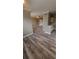 Open-concept living and kitchen area with wood floors at 2558 Robert Trent Jones Dr # 1435, Orlando, FL 32835