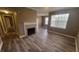 Spacious living room with wood floors and fireplace at 2558 Robert Trent Jones Dr # 1435, Orlando, FL 32835