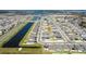 Panoramic aerial view of a residential community featuring modern homes, serene ponds, and well-planned streets at 2739 San Marco Way, Winter Haven, FL 33884