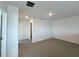 Spacious room with neutral carpet, white walls, and recessed lighting at 2739 San Marco Way, Winter Haven, FL 33884