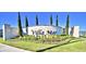 Elegant entrance sign for Villa Mar, showcasing manicured landscaping and a glimpse of a tranquil lake at 2739 San Marco Way, Winter Haven, FL 33884