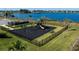 Community playground with slides and swings, surrounded by lush greenery and a tranquil lake backdrop at 2739 San Marco Way, Winter Haven, FL 33884
