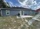 Backyard with patio, grill, and well-maintained landscaping at 2830 Gramercy Dr, Deltona, FL 32738