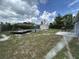 Expansive backyard with a pool, shed, and outdoor seating area at 2830 Gramercy Dr, Deltona, FL 32738