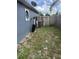 Backyard view showing the water filtration system, AC unit, fencing, and backyard layout at 2830 Gramercy Dr, Deltona, FL 32738