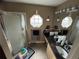 Well-lit bathroom featuring an octagonal window, shower, and granite countertops at 2830 Gramercy Dr, Deltona, FL 32738