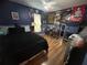 Eclectic bedroom featuring hardwood floors and unique decor at 2830 Gramercy Dr, Deltona, FL 32738