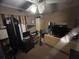 Functional bedroom with a desk, storage, and comfortable furniture at 2830 Gramercy Dr, Deltona, FL 32738