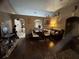 Comfortable dining and living area with hardwood floors, neutral walls, and transitional furniture at 2830 Gramercy Dr, Deltona, FL 32738