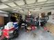 Organized garage with storage shelves, a pool table, and various equipment at 2830 Gramercy Dr, Deltona, FL 32738