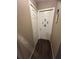 Hallway showcasing two closet doors and modern wood flooring at 2830 Gramercy Dr, Deltona, FL 32738