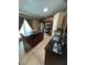 Well-appointed kitchen showcasing a large island and a view of stainless steel appliances at 2830 Gramercy Dr, Deltona, FL 32738