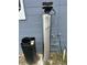 View of water softener system, with metallic cylinder and grey concrete wall at 2830 Gramercy Dr, Deltona, FL 32738