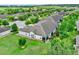 Back aerial view of a home with green landscaping and a screened patio at 3210 Sonesta Ct # B, Clermont, FL 34711