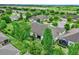 Aerial view of landscaped home with screened lanai and lush greenery at 3210 Sonesta Ct # B, Clermont, FL 34711