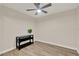 Bright bedroom with wood-look tile flooring and plenty of natural light at 3210 Sonesta Ct # B, Clermont, FL 34711