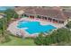 Inviting community pool with plenty of lounge chairs, offering a perfect place for relaxation and socialization at 3210 Sonesta Ct # B, Clermont, FL 34711