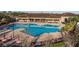 Beautiful community pool area with ample seating and a spacious deck for relaxation and recreation at 3210 Sonesta Ct # B, Clermont, FL 34711