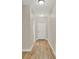 Hallway view of front door and wood-look flooring at 3210 Sonesta Ct # B, Clermont, FL 34711