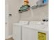 Laundry room with washer, dryer, and wire shelving for storage at 3210 Sonesta Ct # B, Clermont, FL 34711