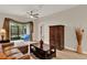 Living room showcasing the tile floors, sliding glass doors to screened patio, and decorative furnishing at 3210 Sonesta Ct # B, Clermont, FL 34711
