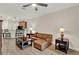 Open living area with a tile floor, ceiling fan, and views of the kitchen and dining area at 3210 Sonesta Ct # B, Clermont, FL 34711