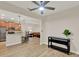 Open-concept living space, featuring wood-look floors, leading into kitchen and living room at 3210 Sonesta Ct # B, Clermont, FL 34711