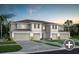 Attractive townhome featuring a two-car garage and well-maintained lawn at 3626 Raindrop Way, Sanford, FL 32773