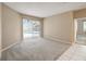 Bedroom featuring neutral walls, carpet flooring, and a sliding glass door with access to the outdoor pool area at 3808 Ocita Dr, Orlando, FL 32837