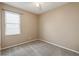Bedroom features neutral paint, carpet, and a window with blinds at 3808 Ocita Dr, Orlando, FL 32837