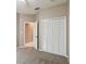 Bedroom showing closet with bi-fold doors and entry to another room at 3808 Ocita Dr, Orlando, FL 32837