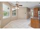 Breakfast nook featuring white tile flooring, large windows, and a ceiling fan for comfortable dining at 3808 Ocita Dr, Orlando, FL 32837