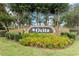 Beautiful Ocita community sign surrounded by vibrant flowers and greenery at 3808 Ocita Dr, Orlando, FL 32837