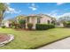Well-maintained single-story home featuring lush landscaping, well manicured lawn, and a serene neighborhood setting at 3808 Ocita Dr, Orlando, FL 32837