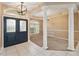 Foyer features double doors, decorative columns, and a large window allowing natural light to flood the entryway at 3808 Ocita Dr, Orlando, FL 32837