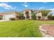 Attractive single-story home with a well-manicured lawn, lush landscaping, and a two-car garage at 3808 Ocita Dr, Orlando, FL 32837