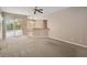 The living room provides access to the outdoor area, the kitchen, and dining room at 3808 Ocita Dr, Orlando, FL 32837