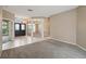 Living room featuring tile flooring, decorative columns, and double doors leading to the foyer and front entrance at 3808 Ocita Dr, Orlando, FL 32837