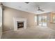 The living room is complete with a fireplace and access to the patio/pool area at 3808 Ocita Dr, Orlando, FL 32837
